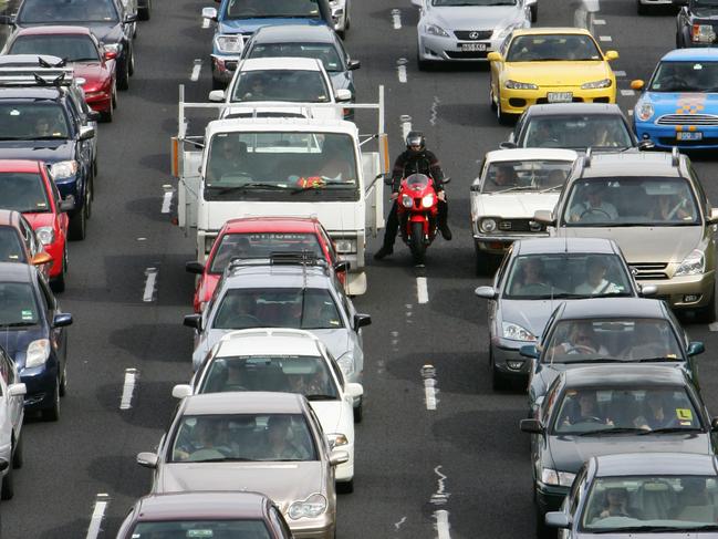 Traffic backed up on the SE Freeway near the Stanley St exit after a truck accident on Dec 16 2007 and emergency services on the scene of the crash