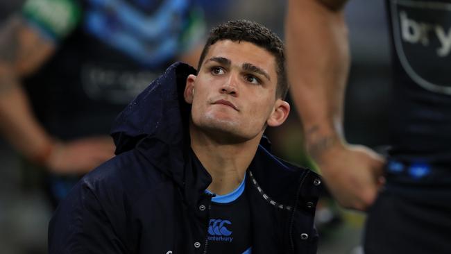 A forlorn Nathan Cleary sits on the sideline after suffering an ankle injury which looks set to rub him out of the decider. Picture: Adam Head