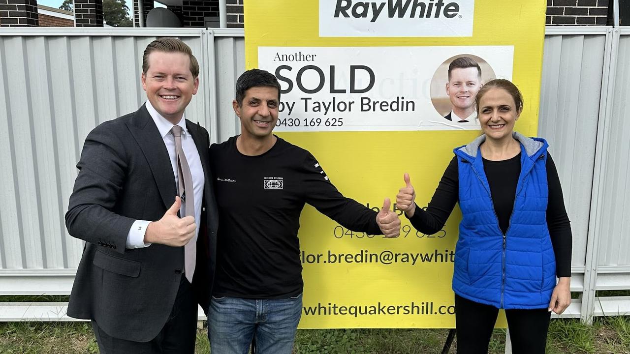 Taylor Bredin with first home buyers Afshin Khaniardestani and Atoosa Hedayat. NSW Real Estate.