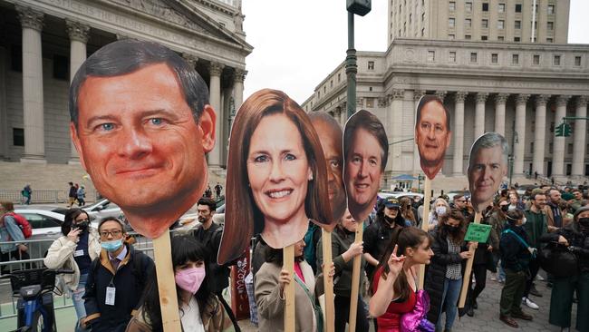 Protesters with cardboard cutouts of Supreme Court justices after a leak revealed the court is poised to strike down the right to abortion in the US. Picture: Bryan R. Smith / AFP)