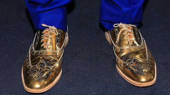 Visy chairman Anthony Pratt's golden shoes in the Furphy marquee on Melbourne Cup day at Flemington Racecourse. Picture: Aaron Francis