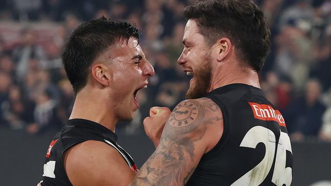 MELBOURNE, AUSTRALIA - September 22, 2023. AFL .   Nick Daicos and Jack Crisp after the 1st preliminary final between Collingwood and the Greater Western Sydney Giants at the MCG in Melbourne, Australia..   Photo by Michael Klein.