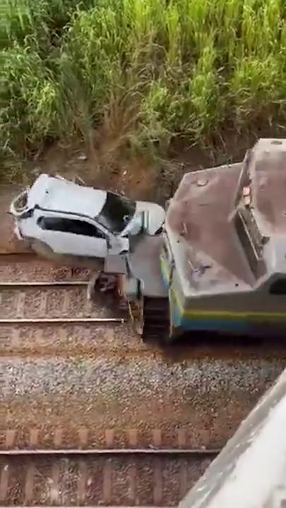 Train smashes into car after driver ‘sleeping’ driver plunges onto railway