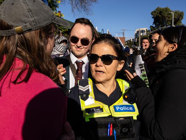 People attending the conference get shoved and pushed as they entered. Picture: Diego Fedele