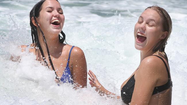 Enjoying the sunshine and surf at Miami are Emily Horner 18 from Miami and Ruby Swift 17 from Mermaid Beach. Picture Glenn Hampson (contact No Emily 0414170244)