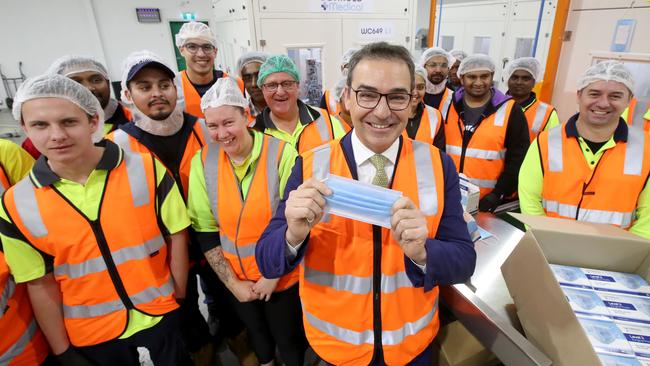 Premier Stephen Marshall with staff at Detmold Packaging, where the PPE masks are now being made. Picture: Kelly Barnes