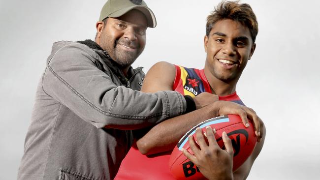 AFL draft prospect Kysaiah Pickett, in his State jumper, with his uncle, former Kangaroos’ and Power hardman Byron Pickett. Picture: AAP