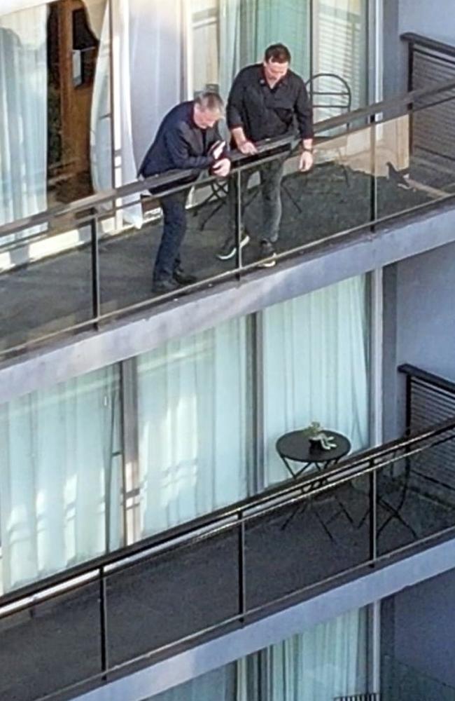 Geoff Payne, left, standing on the balcony from which his son tragically fell. Picture: BACKGRID