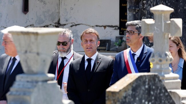 President Macron, centre, and President Steinmeier, far left, visit a cemetery in Oradour-sur-Glane on the 80th anniversary of the massacre. Picture: EPA/The Times