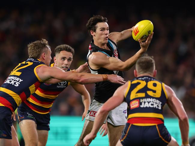 ADELAIDE, AUSTRALIA - MAY 02: Connor Rozee of the Power handpasses the ball during the 2024 AFL Round 08 match between the Adelaide Crows and the Port Adelaide Power at Adelaide Oval on May 02, 2024 in Adelaide, Australia. (Photo by Sarah Reed/AFL Photos via Getty Images)