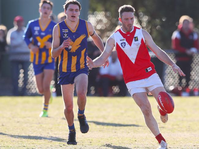 Sean Holmes takes a kick for Red Hill against Somerville in MPNFL Division 2 in 2019. Picture: David Crosling