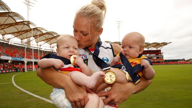 Erin Phillips celebrates the AFLW Grand Final win with children Blake and Brooklyn. Pictures: Getty Images)