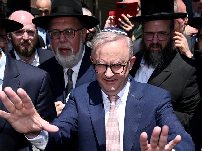 Prime Minister Anthony Albanese leaves after visiting the Adass Israel Synagogue after a firebombing in Melbourne, Tuesday, December 10, 2024. (AAP Image/Joel Carrett) NO ARCHIVING