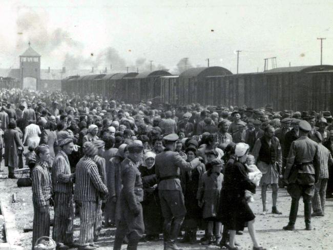 History’s shadow … Nazis select prisoners on the platform at the entrance of the Auschwitz-Birkenau extermination camp in Poland.