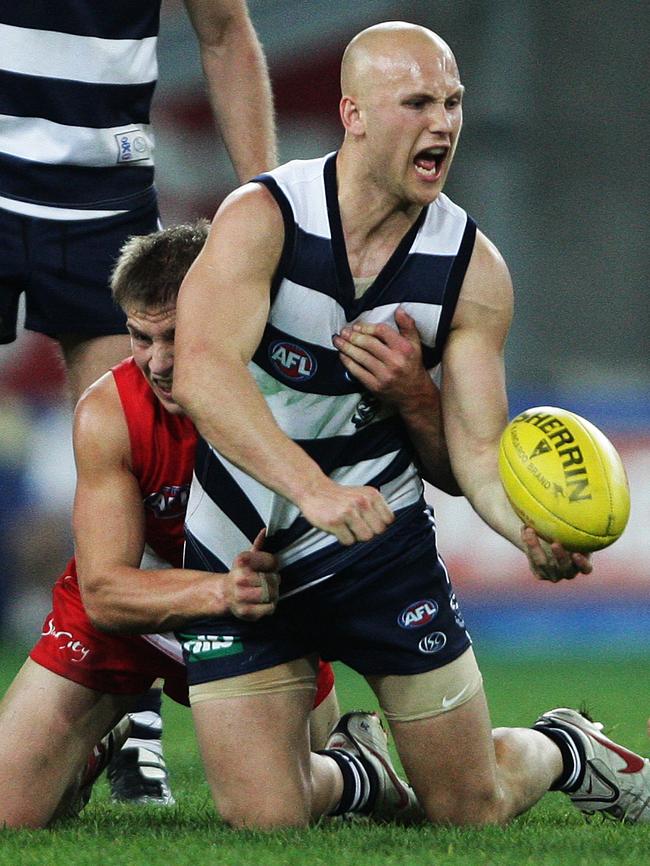 Gary Ablett is tackled by Kieren Jack.