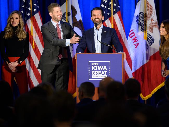 Donald Trump Jr, centre, speaks with his brother Eric (second from life) and wife Lara, as well as his girlfriend Kimberly Guilfoyle (far right) during a Keep Iowa Great press conference. Picture: AFP