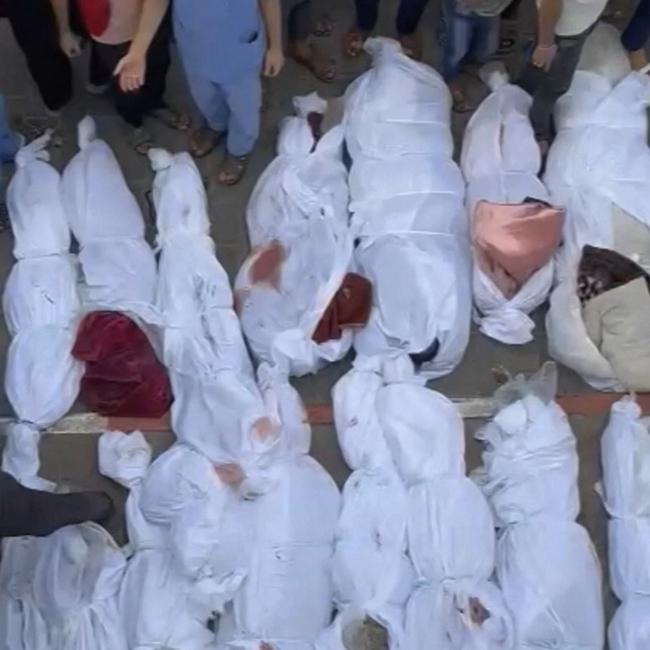 The bodies of Palestinians killed in a strike on a refugee camp in Jabalia on the northern Gaza Strip.