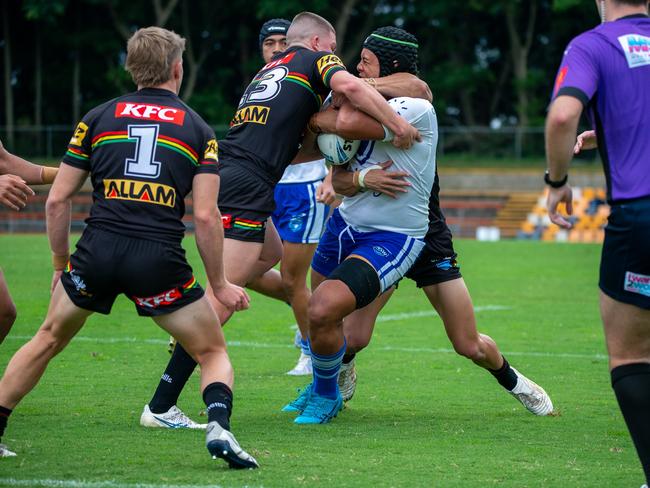 David Leota cops a high shot from the defence. Picture: Thomas Lisson