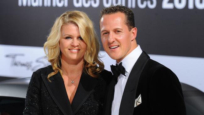 Michael Schumacher and his wife Corinna. AFP PHOTO / JENS KALAENE.