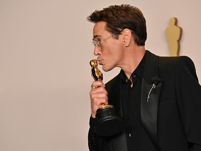 US actor Robert Downey Jr. poses in the press room with the Oscar for Best Actor in a Supporting Role for "Oppenheimer". Picture: AFP