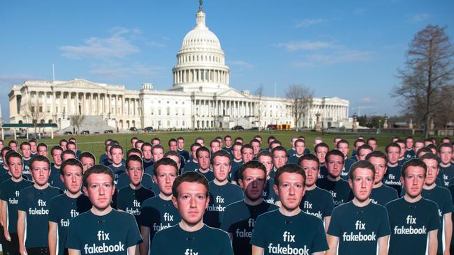 One hundred cardboard cutouts of Facebook founder and CEO Mark Zuckerberg stand outside the US Capitol in Washington, DC. Picture: AFP