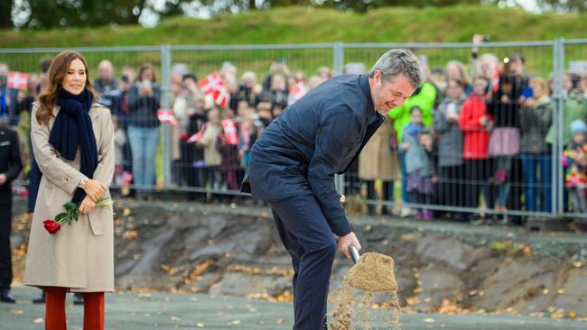 Mary watches on as Frederik gets to work during ceremony for the new construction project of Danevirke Museum near Flensburg, Germany. Picture: Getty Images