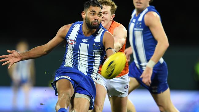 HOBART, AUSTRALIA - JUNE 13: Tarryn Thomas of the Kangaroos kicks the ball during the round 13 AFL match between the North Melbourne Kangaroos and the Greater Western Sydney Giants at Blundstone Arena on June 13, 2021 in Hobart, Australia. (Photo by Steve Bell/Getty Images)