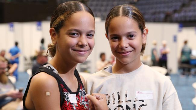 12 year old twins Shiloh and Sienna Nakachi of Kanimbla took the opportunity to get vaccinated against the Covid-19 coronavirus at the mass vaccination hub set up in the Cairns Convention Centre. Picture: Brendan Radke