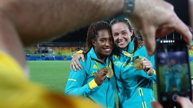 Gold medallists Ellia Green and Chloe Dalton show off their hard won spoils.