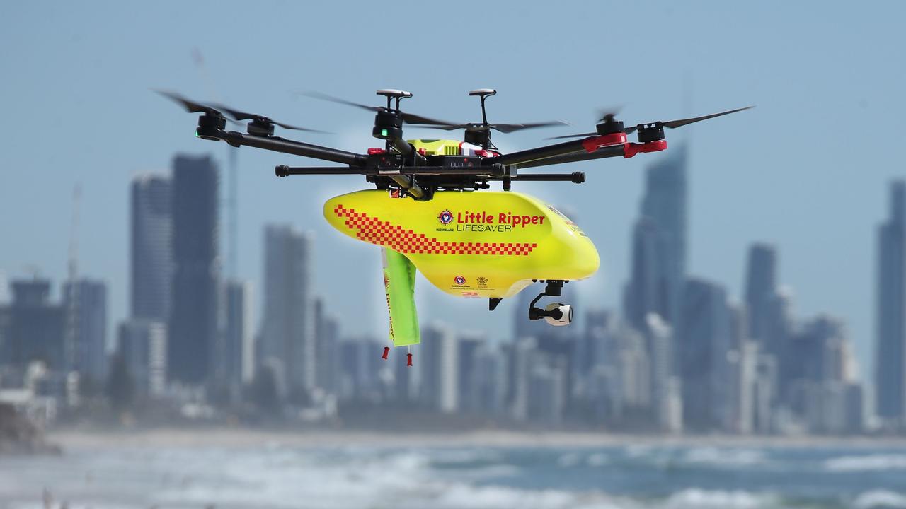 A Little Ripper Lifesaver drone flies over a Gold Coast beach. It is part of a fleet that will fly simultaneously along the east coast of Australia and be monitored from a central control room to help keep beaches safe over summer. Picture Glenn Hampson