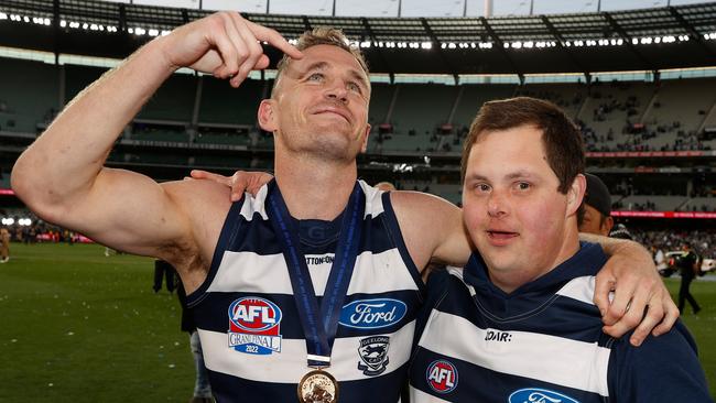 Joel Selwood and Sam Moorfoot celebrate Geelong’s victory.