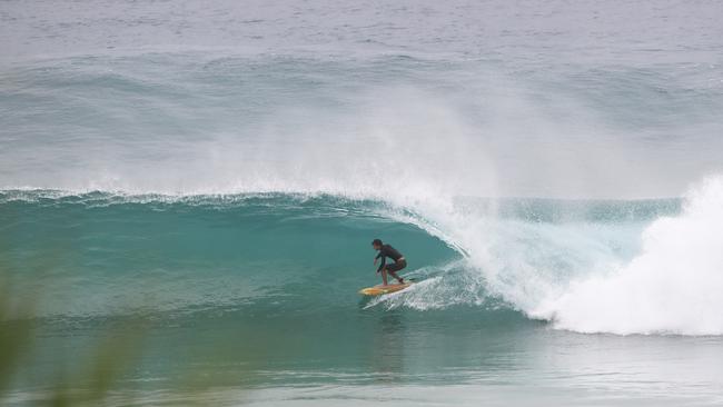 Surfers at Snapper Rocks and Kirra riding the Large swell produced by Cyclone OMA. Photograph : Jason O'Brien