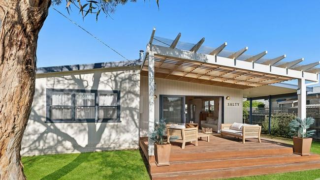 The 'Salty' shack at 27 Swan Pde, St Leonards, is a popular Airbnb listing that's now selling for $800,000 to $850,000.