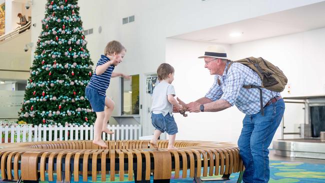 The first flights direct from Melbourne in months have touched down in Darwin after restrictions on quarantine were relaxed at midday. Ace Hardy meets his grandkids for the first time since Christmas 2019. Picture: Che Chorley