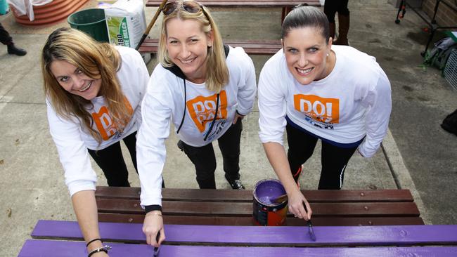 Newslocal’s Heidi King-Langdon, Amanda Vass and Melanie Morson of Castle Hill RSL get cracking on the painting.