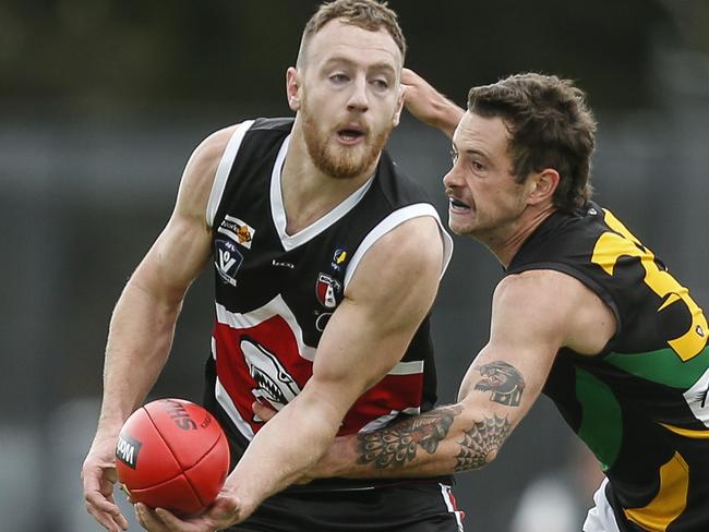 MPNFL football Division 1 - Bonbeach v Dromana. Jackson Casey (Bonbeach) tackled by Dean Waugh (Dromana). Picture: Valeriu Campan