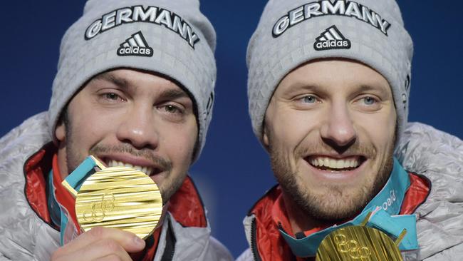 Germany's luge doubles gold medallists Tobias Wendl (left) and Tobias Arlt pose on the podium. Photo: AFP