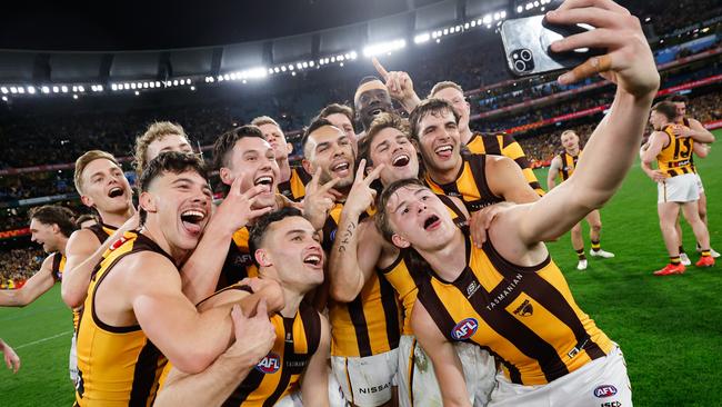 MELBOURNE, AUSTRALIA - SEPTEMBER 06: Calsher Dear of the Hawks takes a selfie with teammates during the 2024 AFL Second Elimination Final match between the Western Bulldogs and the Hawthorn Hawks at The Melbourne Cricket Ground on September 06, 2024 in Melbourne, Australia. (Photo by Dylan Burns/AFL Photos via Getty Images)