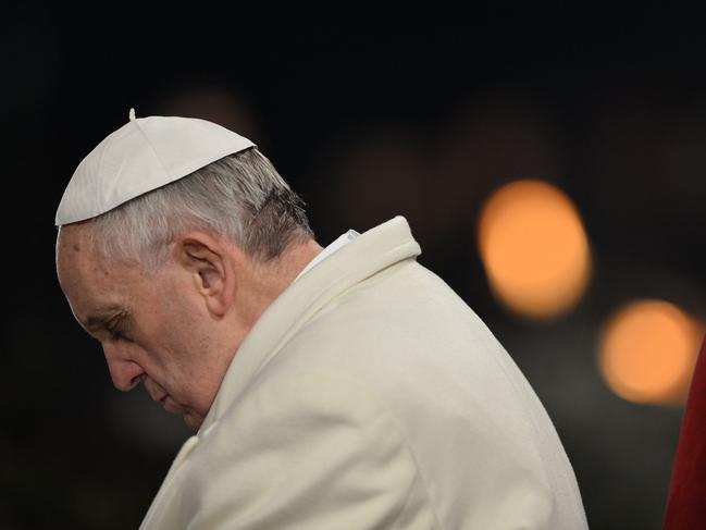 (FILES) Pope Francis attends the celebration of the Way of the Cross on Good Friday at the Colosseum in Rome on March 29, 2013. The Vatican said on April 24, 2025, that nearly 50,000 people had so far paid their respects to Pope Francis, whose body is lying in state at St Peter's Basilica for three days before his funeral, which is set for April 26 morning. (Photo by Gabriel BOUYS / AFP)