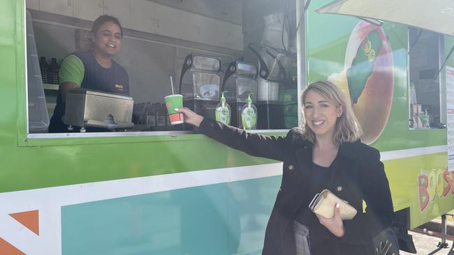 Katrina Visentin buying her favourite Mango Magic smoothie from the Stanthorpe pop-up store.