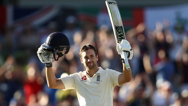 Dawid Malan celebrates England’s first century of the series.