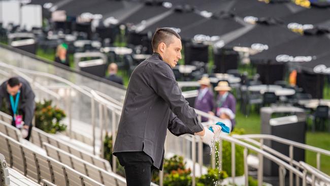 Staff frantically dry seats. Picture: Jason Edwards