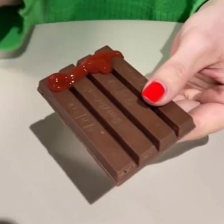 The latest disturbing food trend gracing people’s For You pages on TikTok is a KitKat bar slathered with … tomato sauce. Picture: TikTok