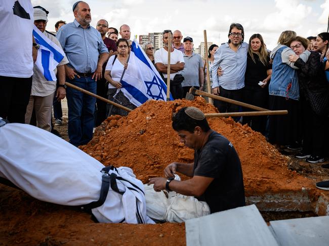 Mourners grieve during the funeral of Peruvian-Israeli Dr. Daniel Levi Ludmir at Yehud Monosun cemetery near Tel Aiv, Israel. The civilian was reportedly killed while treating the wounded. Picture: Leon Neal/Getty Images