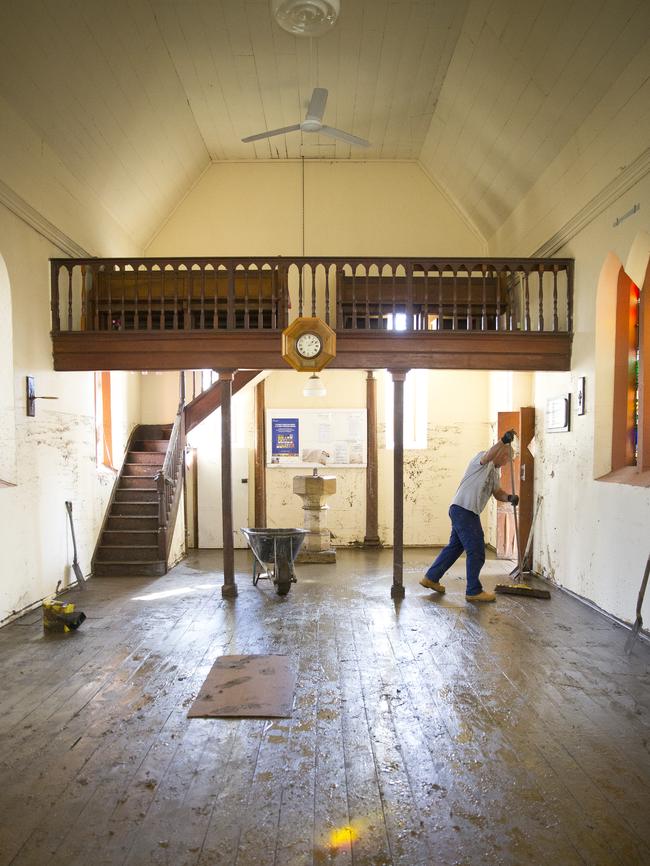 Mopping up at a muddy St Marks Anglican Church in Picton. Picture: Melvyn Knipe