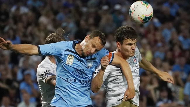 Curtis Good, right, tussles with Alex Wilkinson during Melbourne City’s loss to Sydney FC on Sunday. Picture: AAP