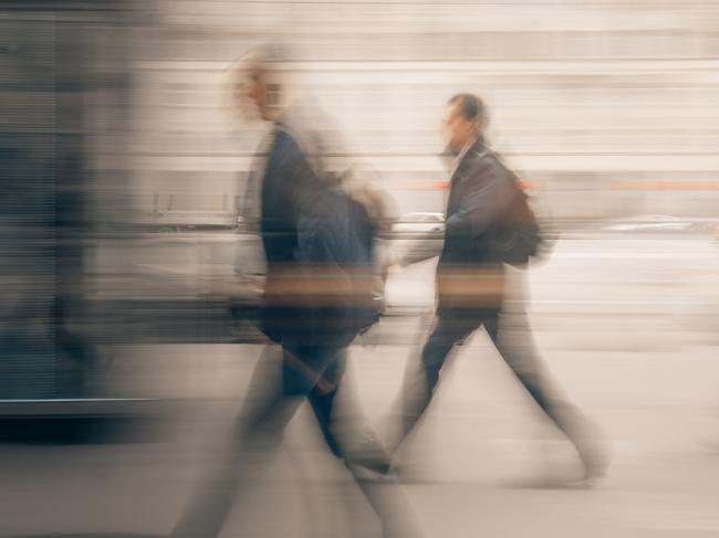 Blurred Motion Of People Walking In City