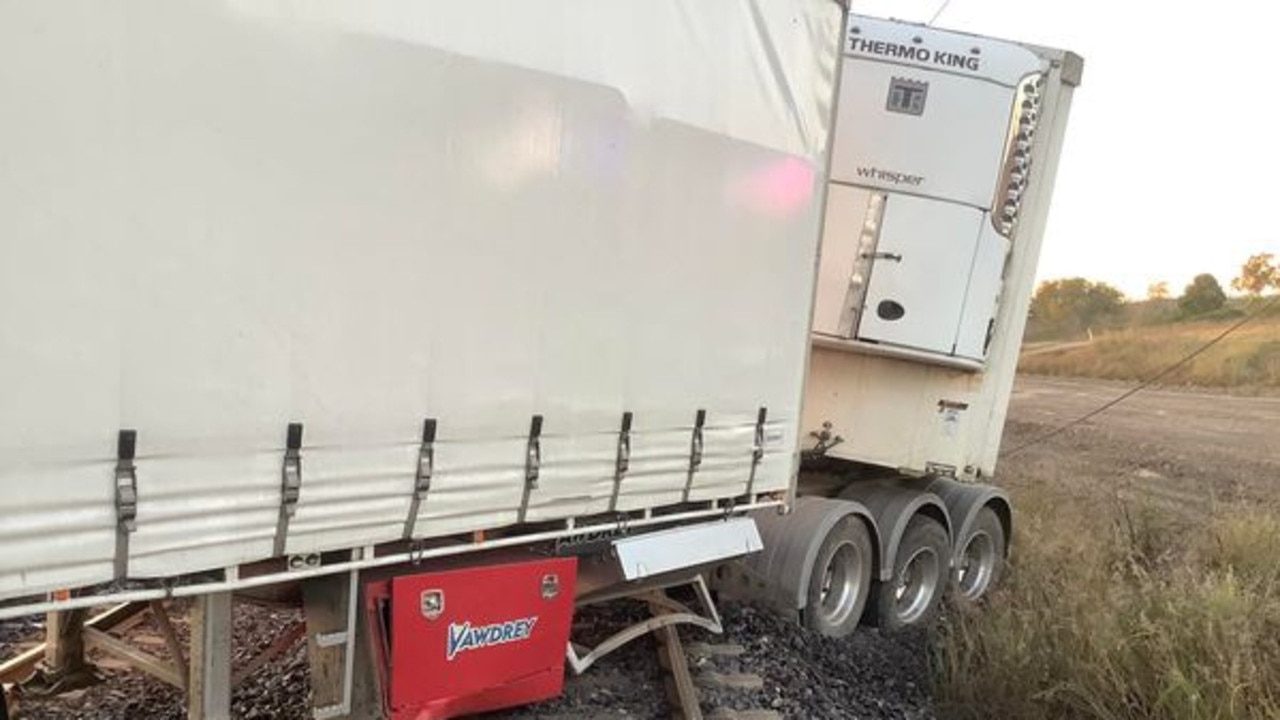 The B-double truck on the railway lines at Raglan. Photos: QPS