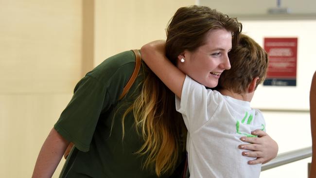 Mollie Coker’s welcomed home by brother Rex. Photo: Steve Holland