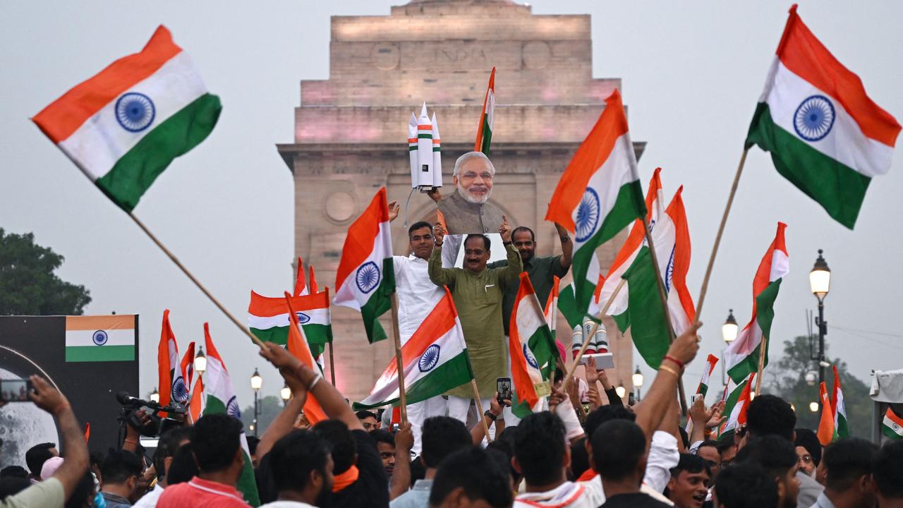 Indians in New Delhi celebrate the successful lunar landing of Chandrayaan-3 spacecraft on the south pole of the moon on August 23. Picture: Arun Sankar/AFP